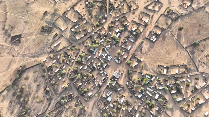 Aerial picture of a village in a dry Sahel field