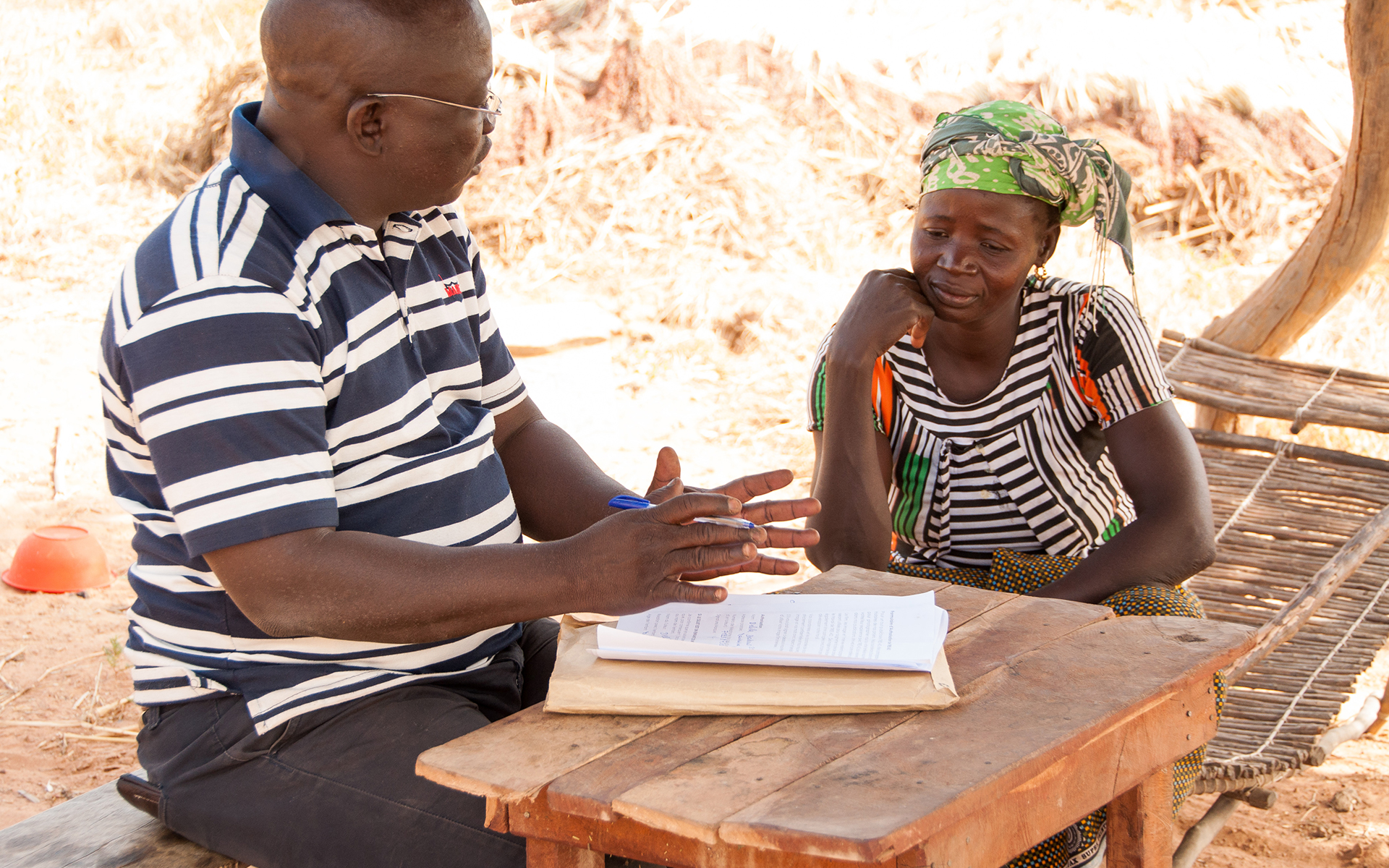 Delila, a woman on Tree Aid's Mali forest management project, with staff member.