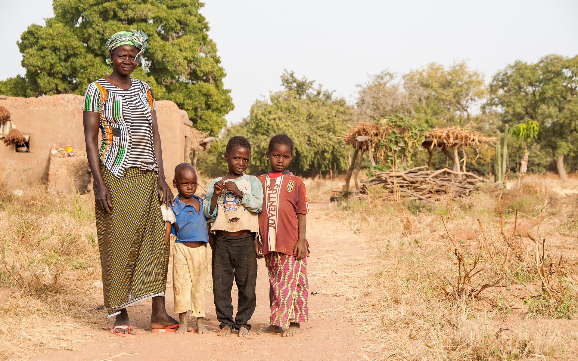 Delila, a woman on Tree Aid's Mali forest management project, with her three children.