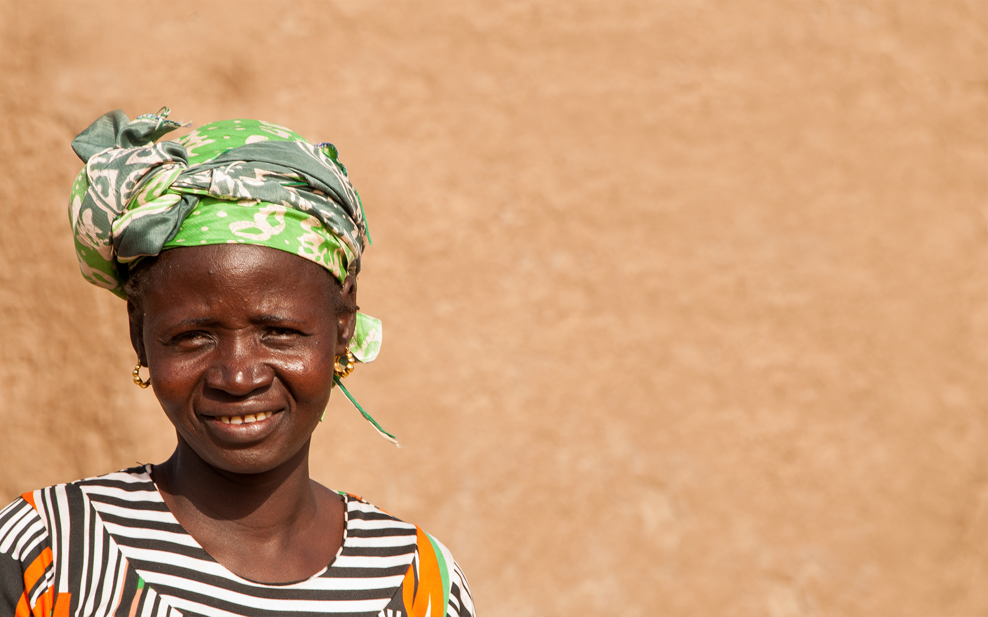 Delila, a woman on Tree Aid's Mali forest management project, smiling.